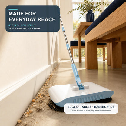 Full-size manual sweeper cleaning beside a baseboard and dining table